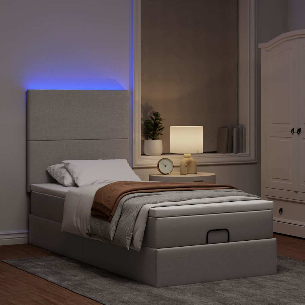 Ottoman bed met matras en LED's 90x200cm stof taupe