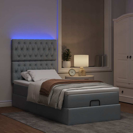 Ottoman bed met matras en LED's 80x200cm stof lichtgrijs